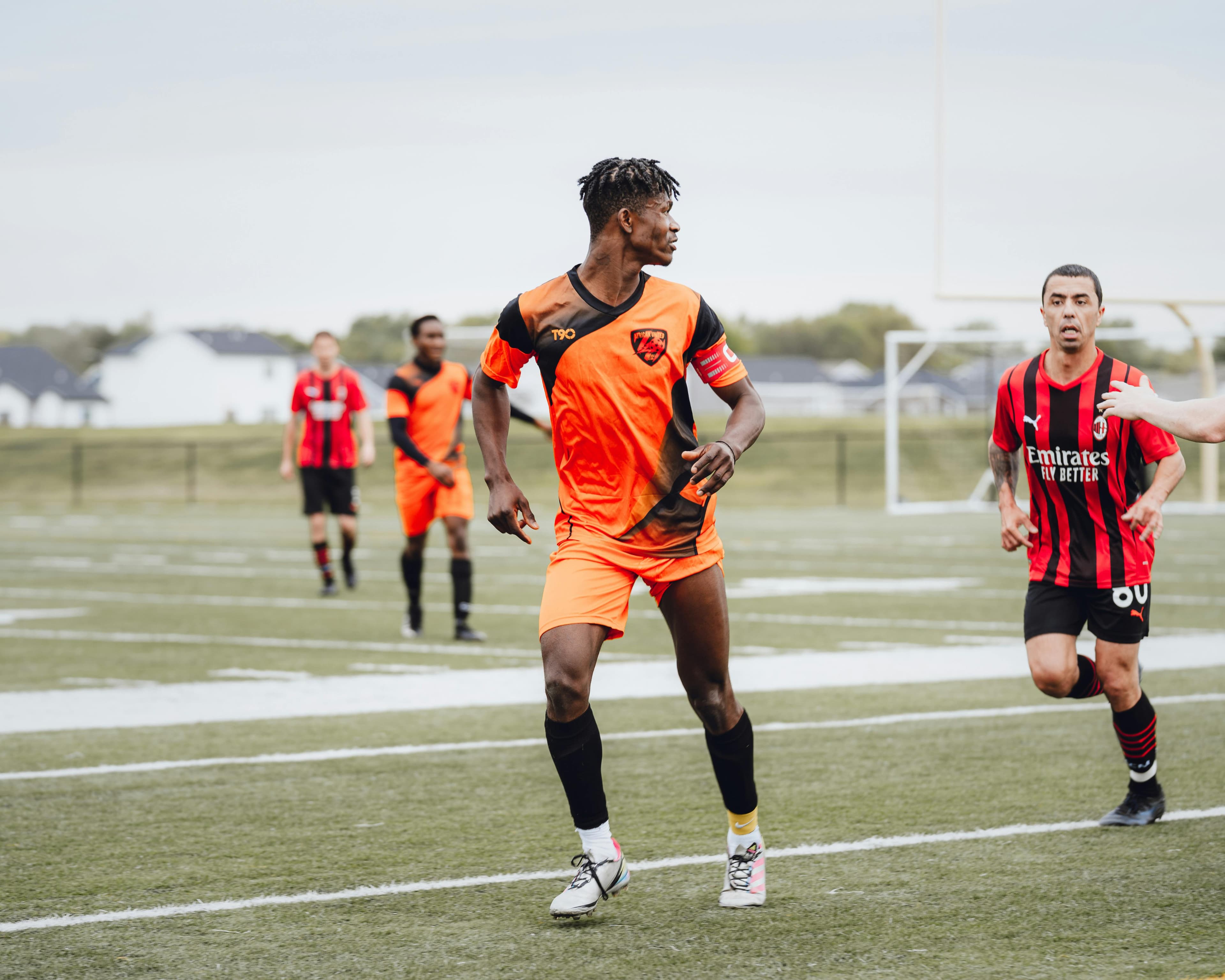 Football player in orange jersey